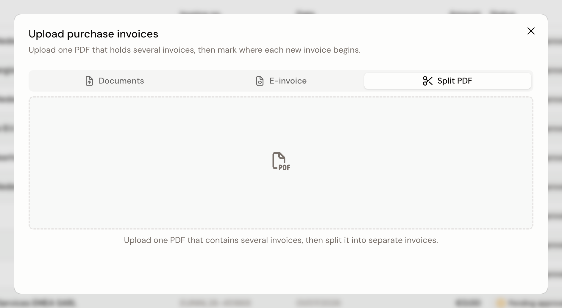 The Split PDF tab in the upload dialog, with the box you drag one PDF holding several invoices into