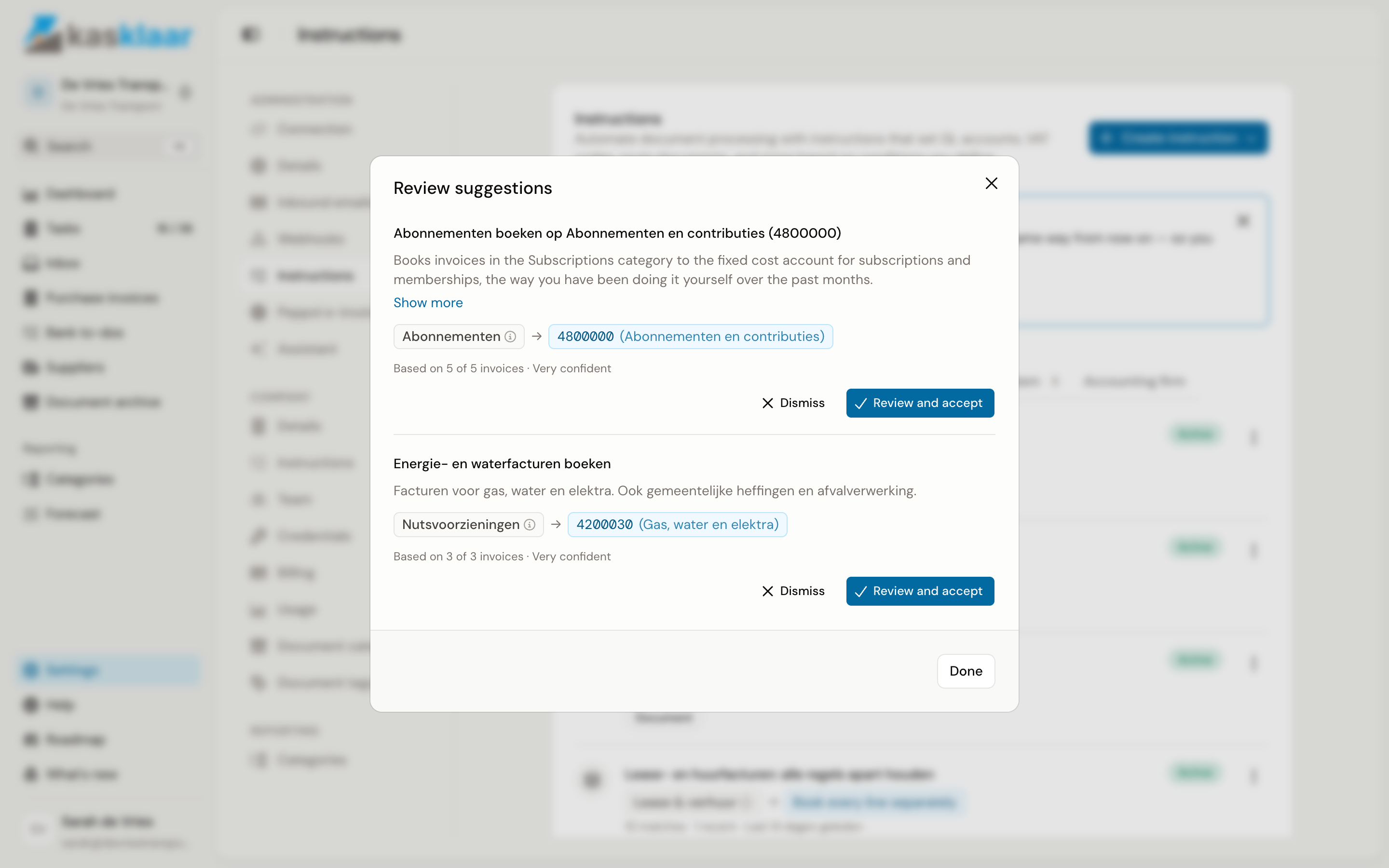 The Review suggestions dialog with two suggestions, each with name, description, condition and GL account, the line Based on 5 of 5 invoices with Very confident, and the Dismiss and Review and accept buttons